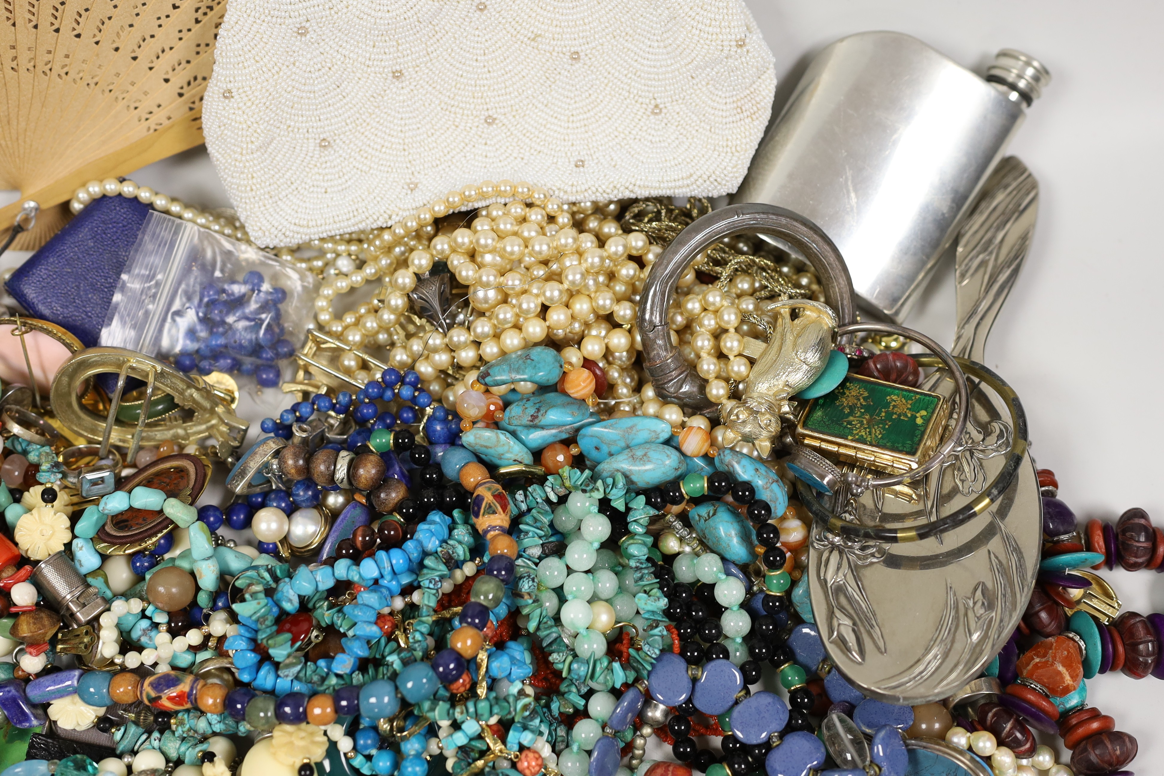 A quantity of assorted costume jewellery, including white metal and moonstone bracelet and other items including a small silver plated Dunhill lighter.